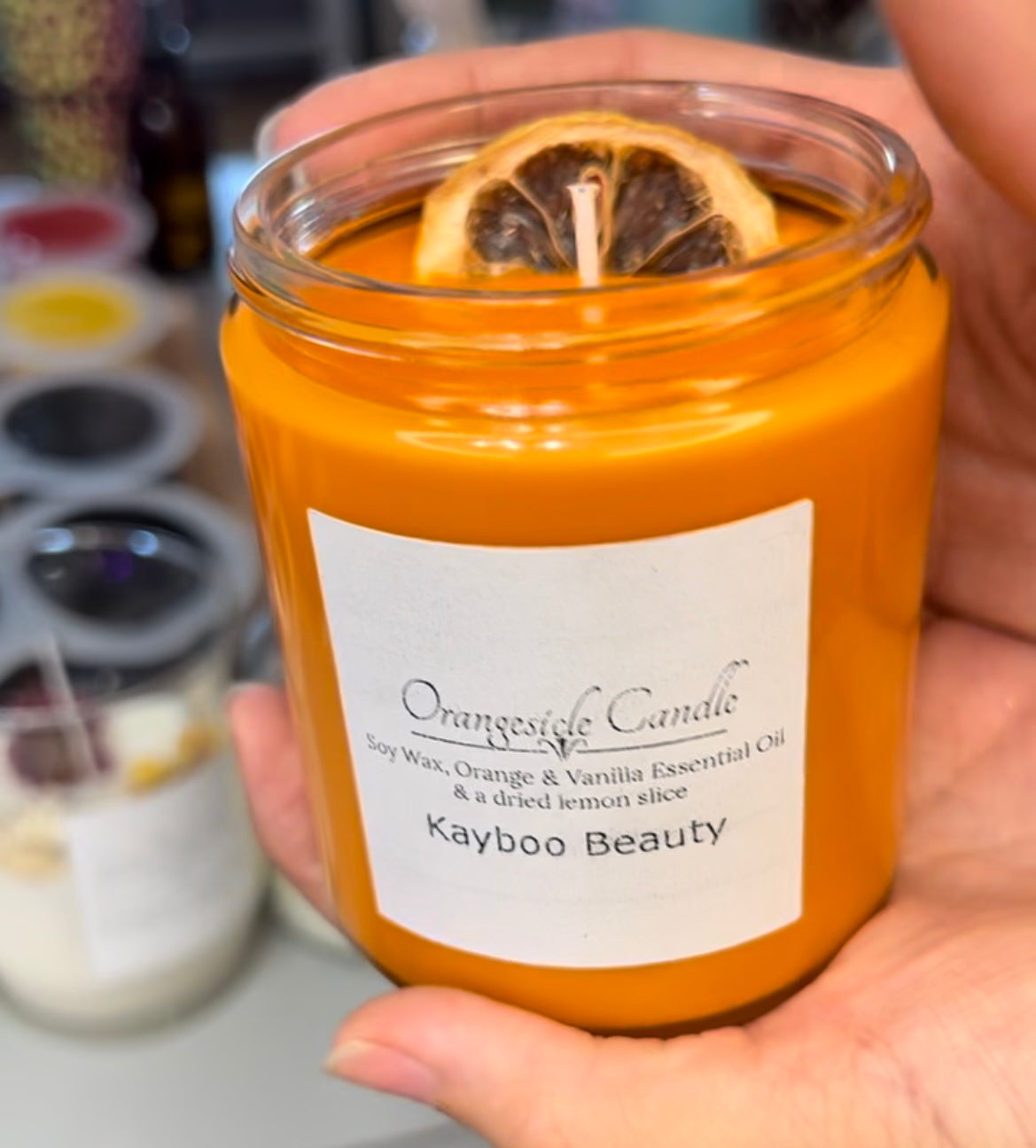 Kayboo Beauty Orangesicle Candle with a lemon or orange slice 🍊